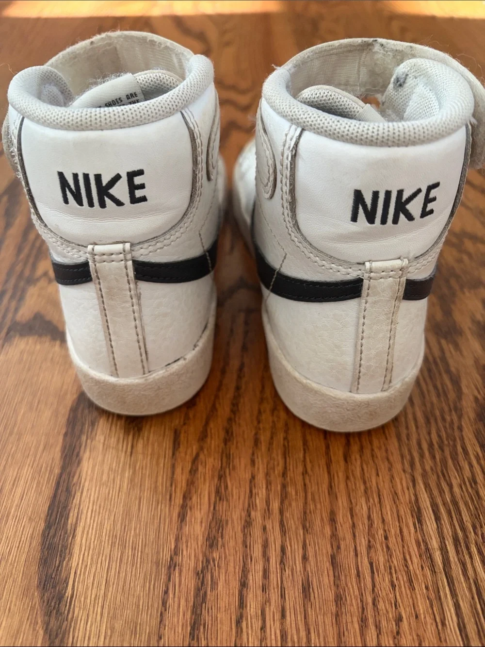 Nike Kids High-Top Sneakers in White with Black Swoosh